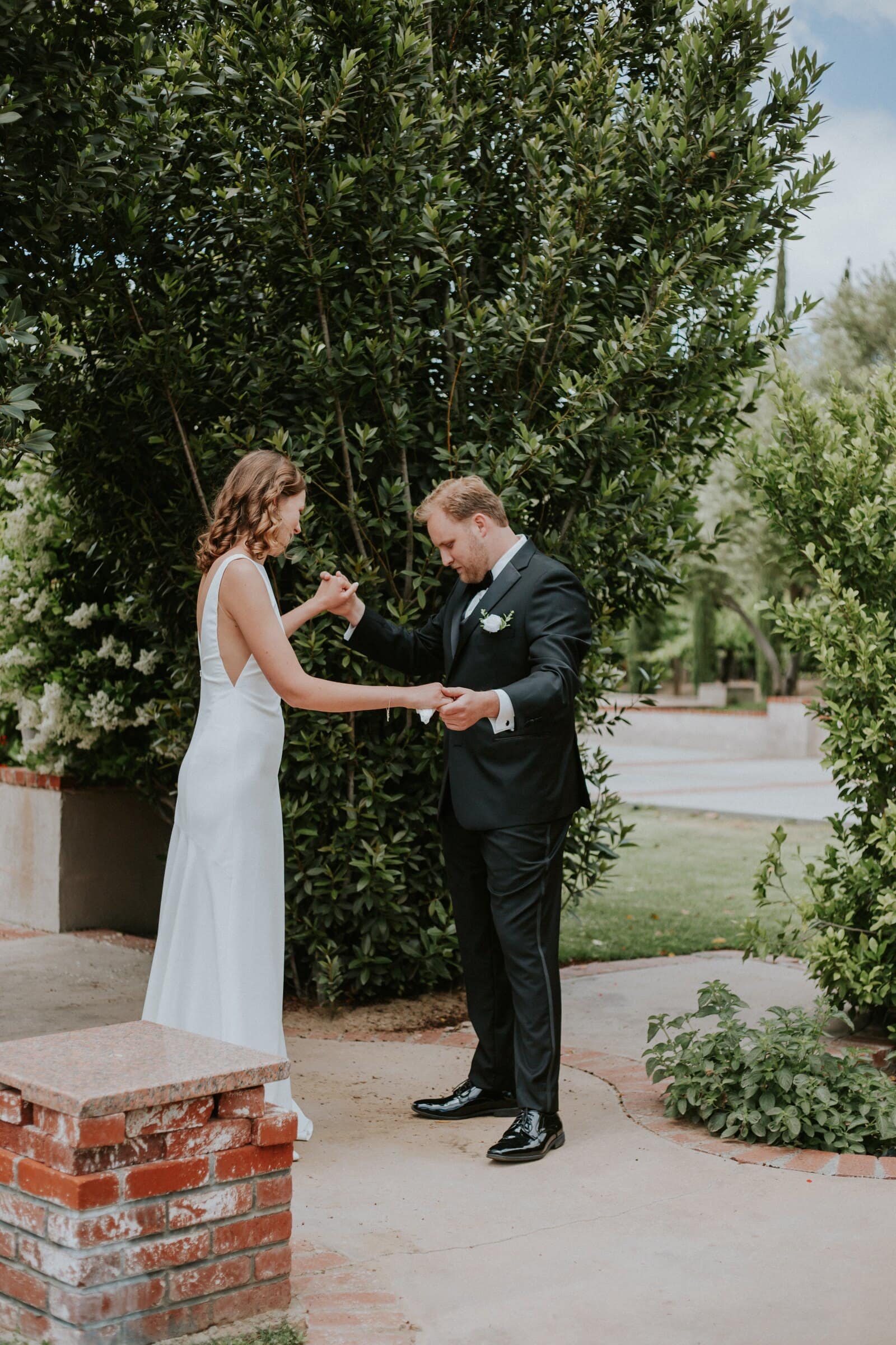 Blake and Ava holding hands after the first look