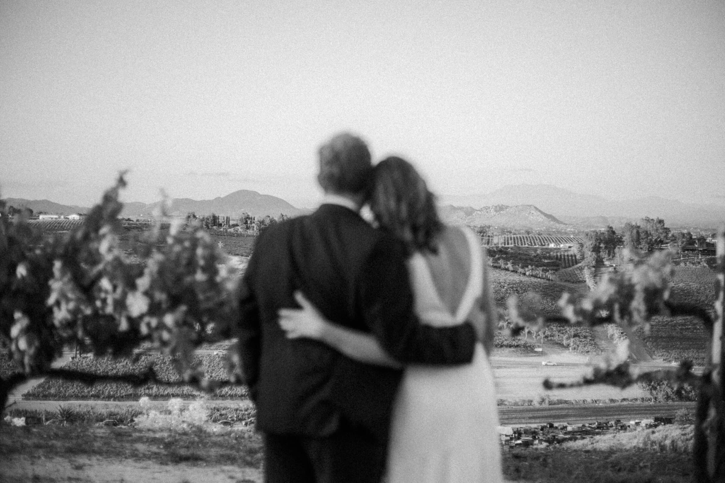Blake and Ava looking out over the valley, in black and white