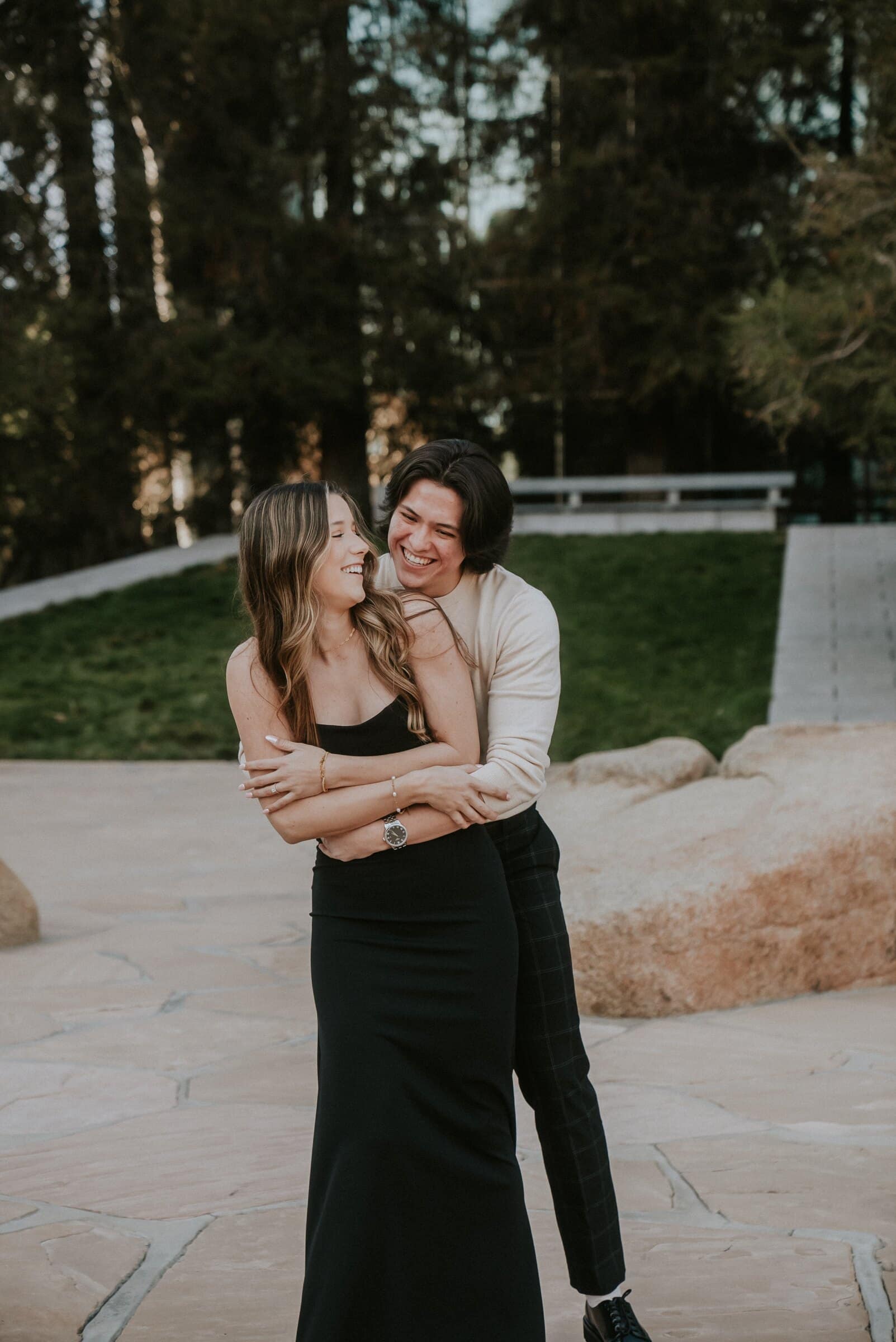Cameron and Amanda laughing together among the boulders