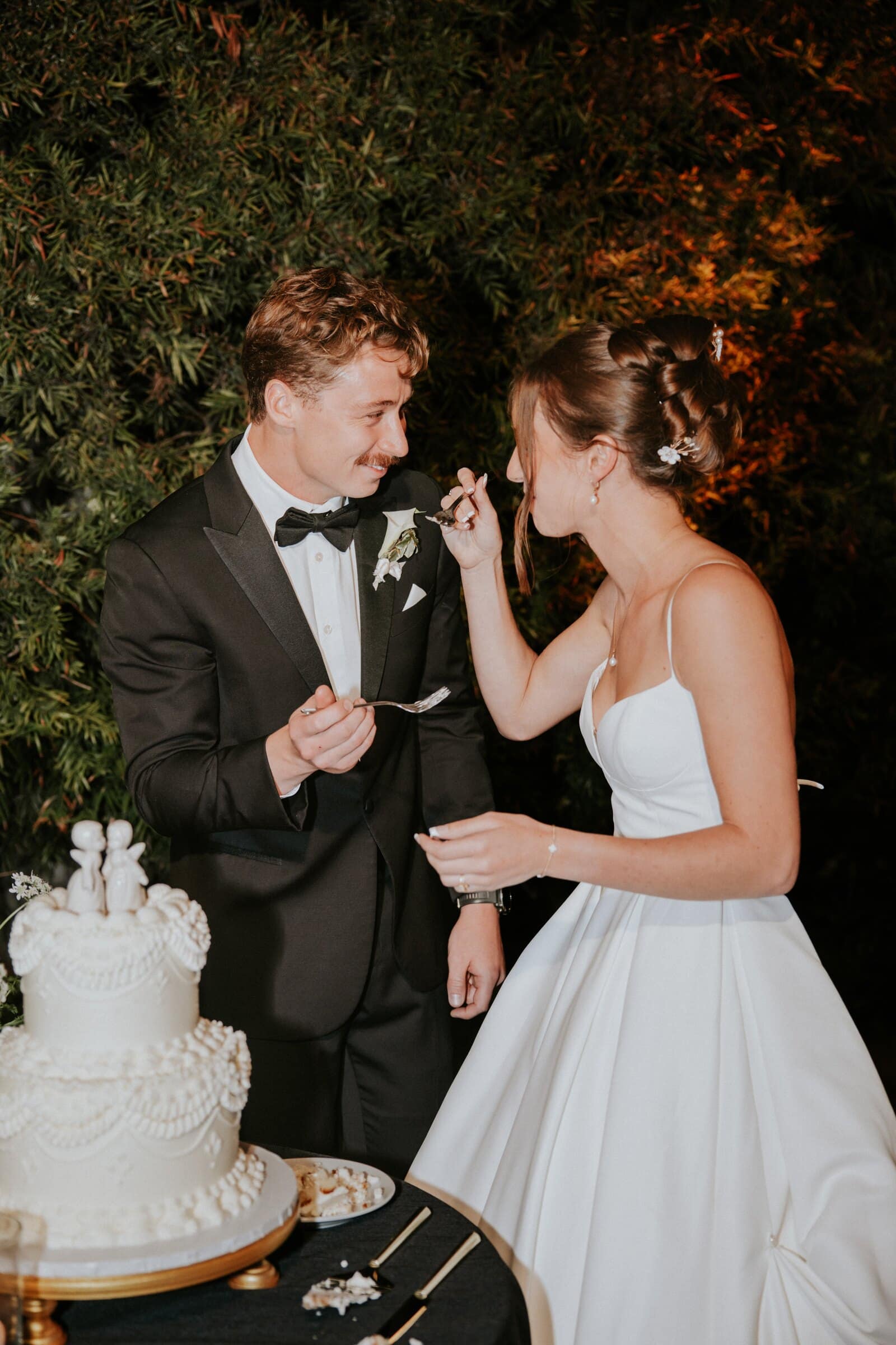 Clara and Grant cutting the cake