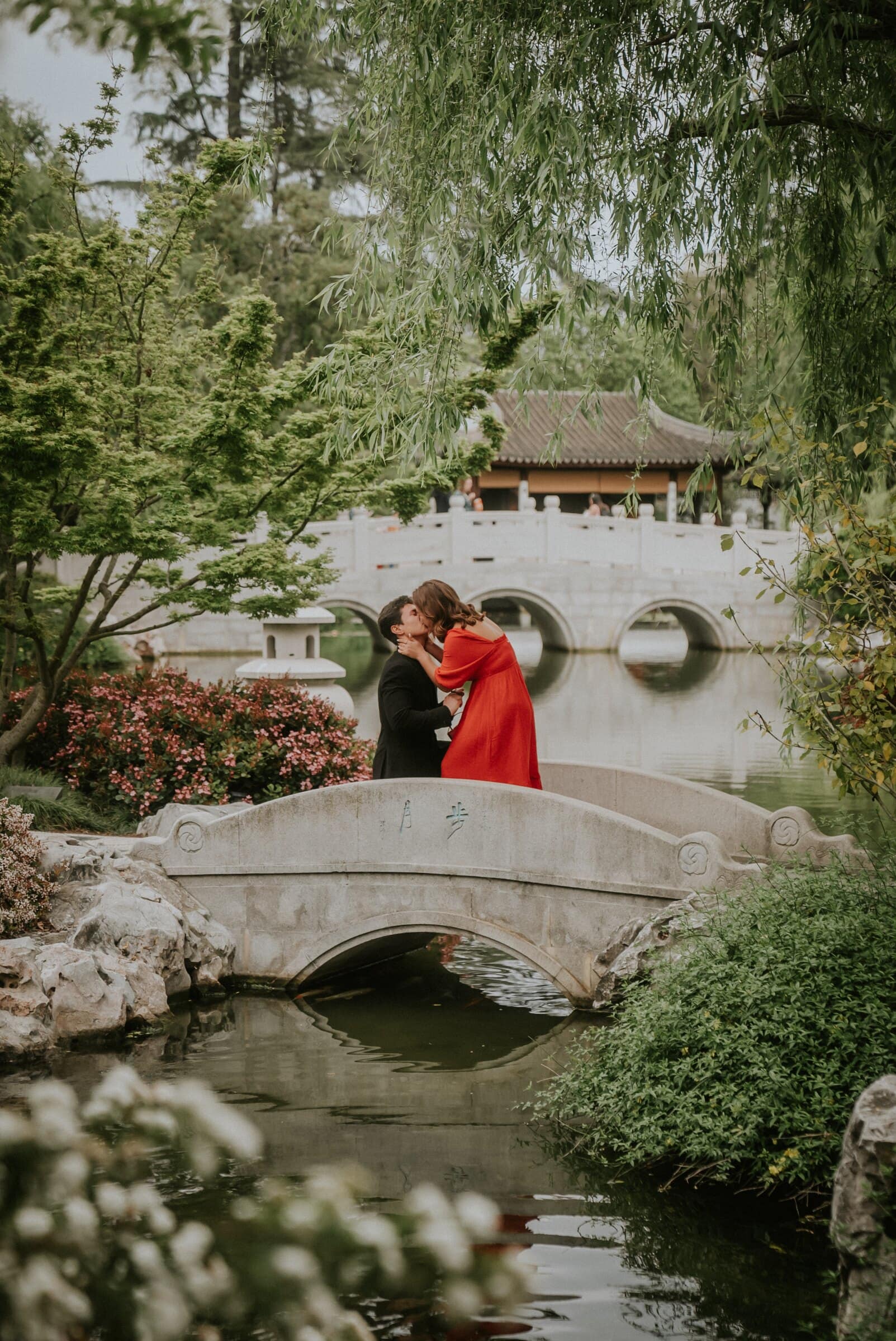 David and Natalie embracing on the bridge after the proposal