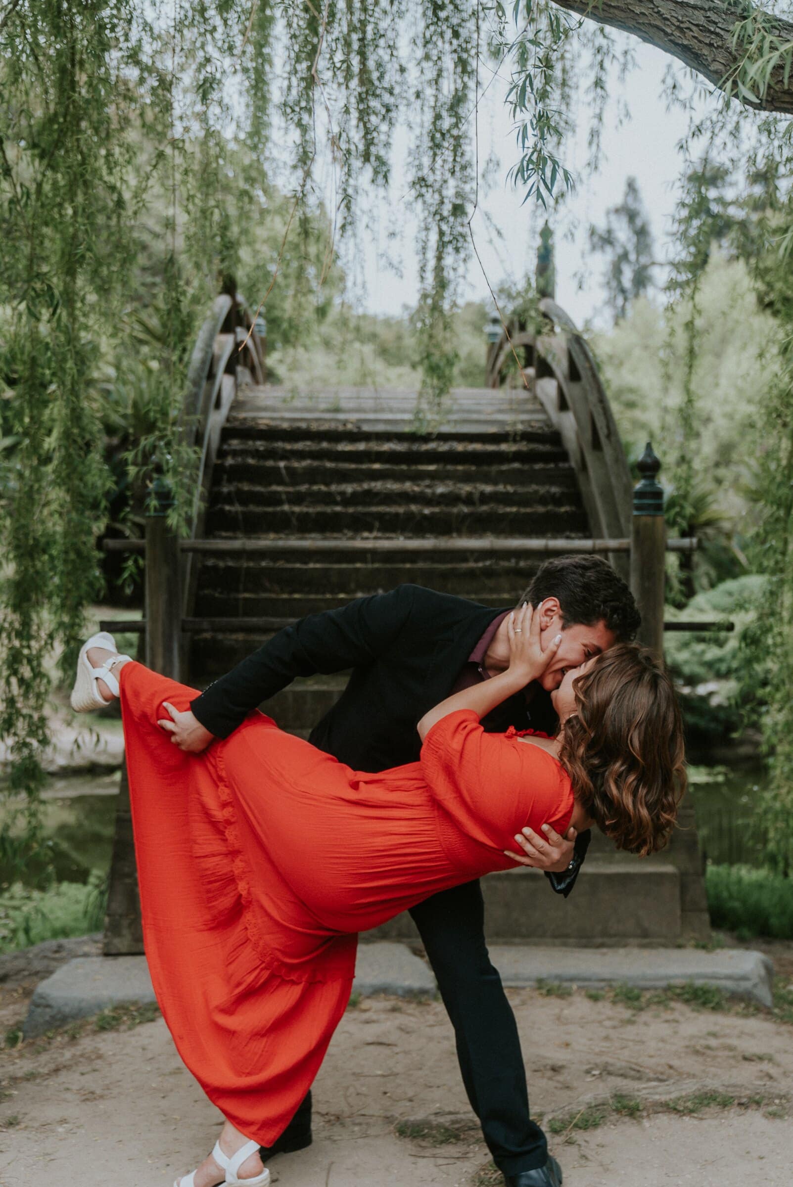 A dip and a kiss at the foot of the wooden bridge steps