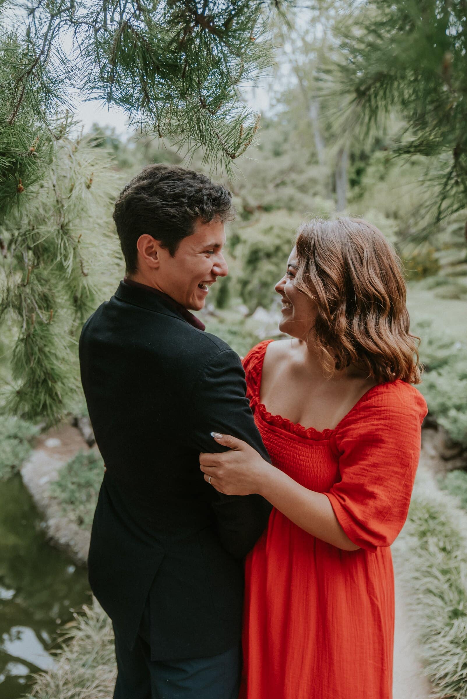 David and Natalie holding each other among the willows