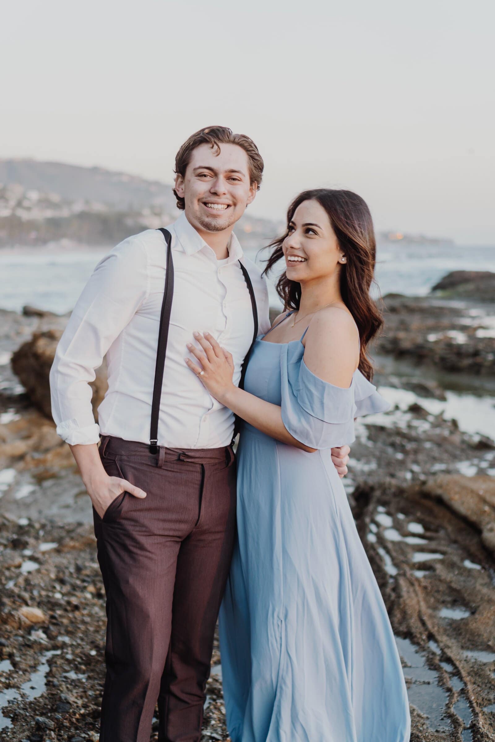 Dylan and Jasmine side by side on the rocks, both grinning