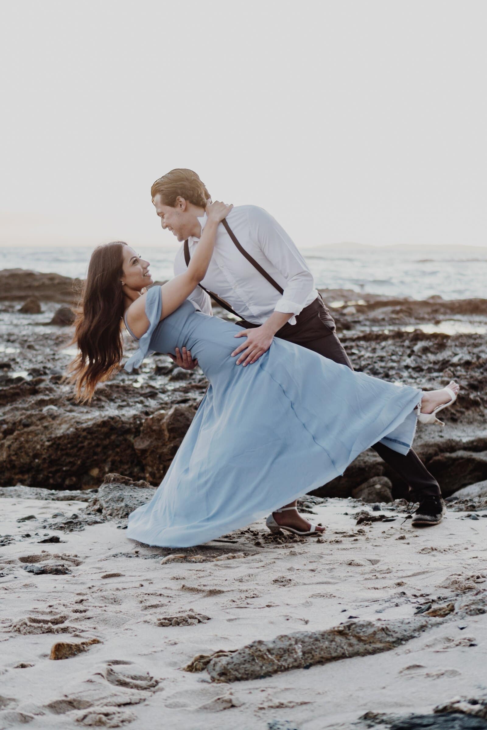 Dylan dipping Jasmine on the sand