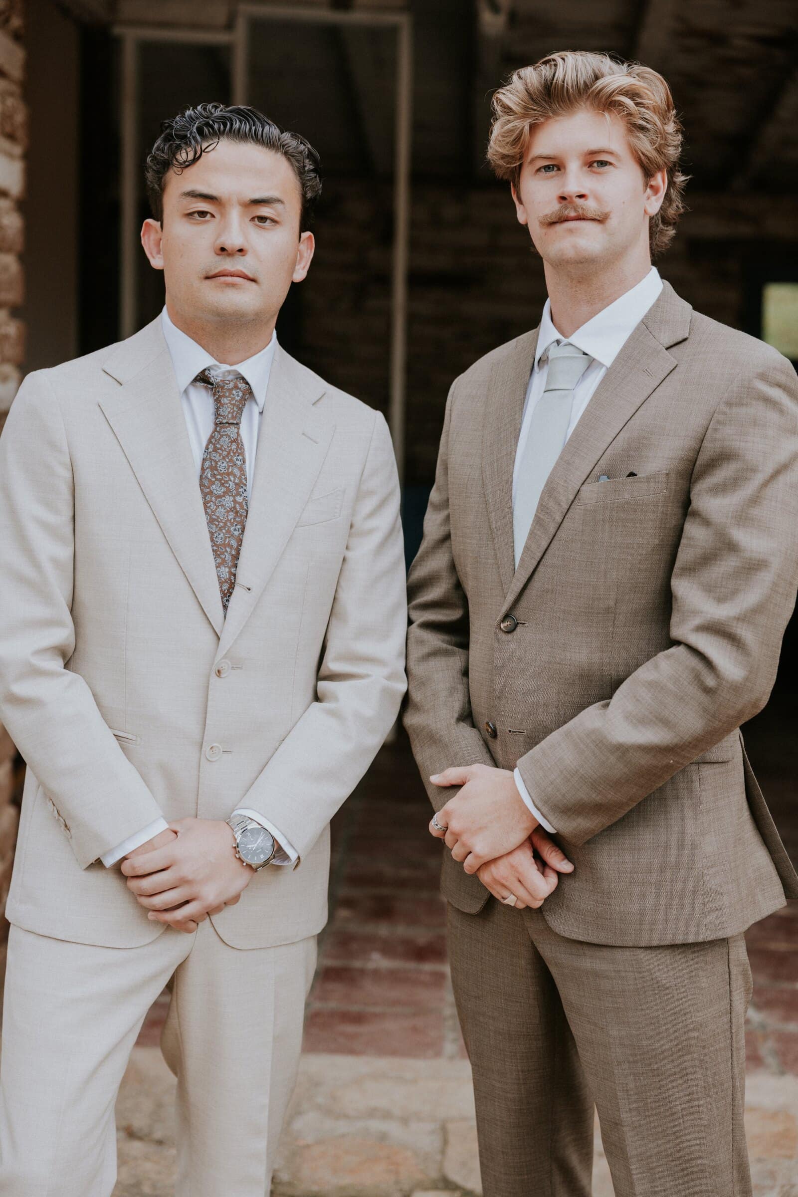 Caleb and a groomsman in tan suits