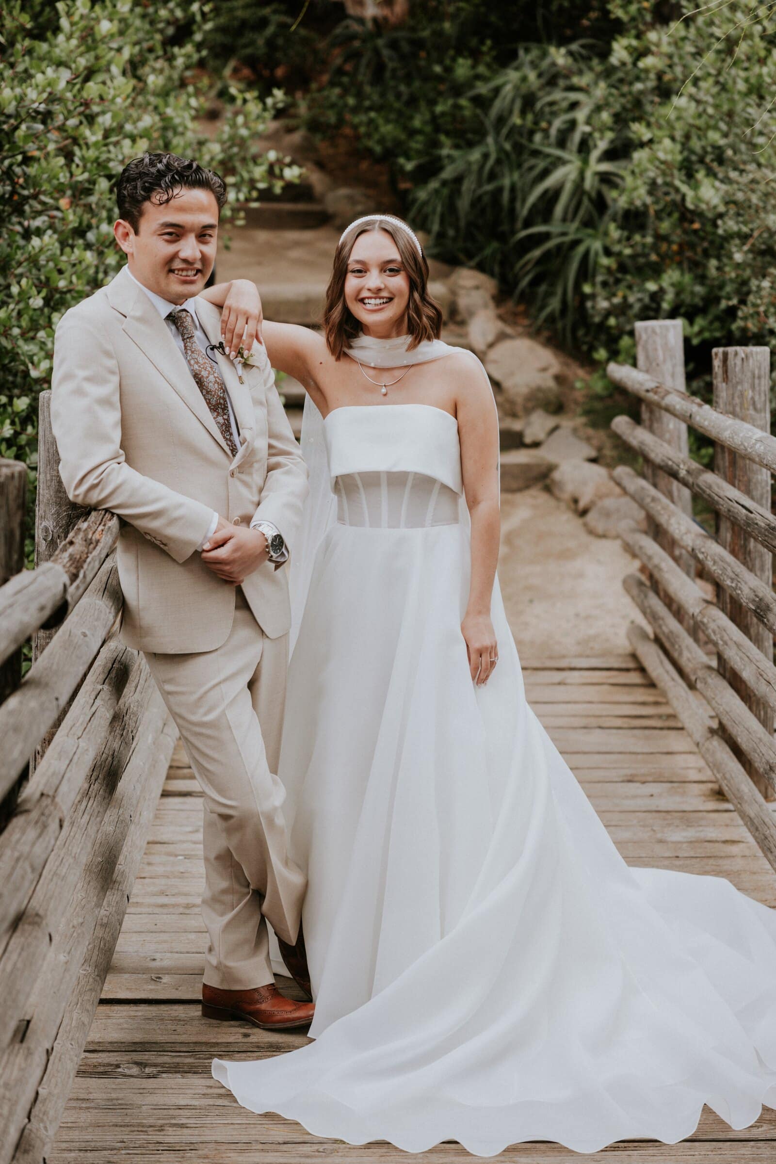 Megan and Caleb laughing on the wooden footbridge