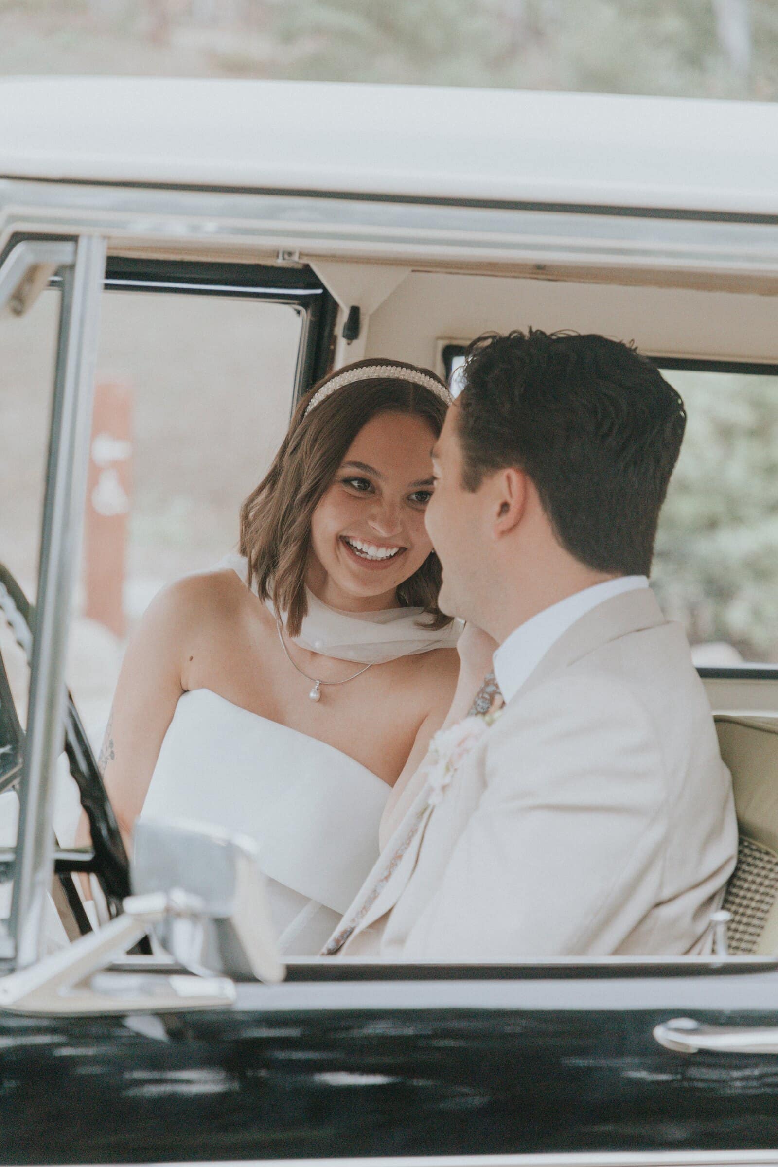 Megan and Caleb close together in the Bronco