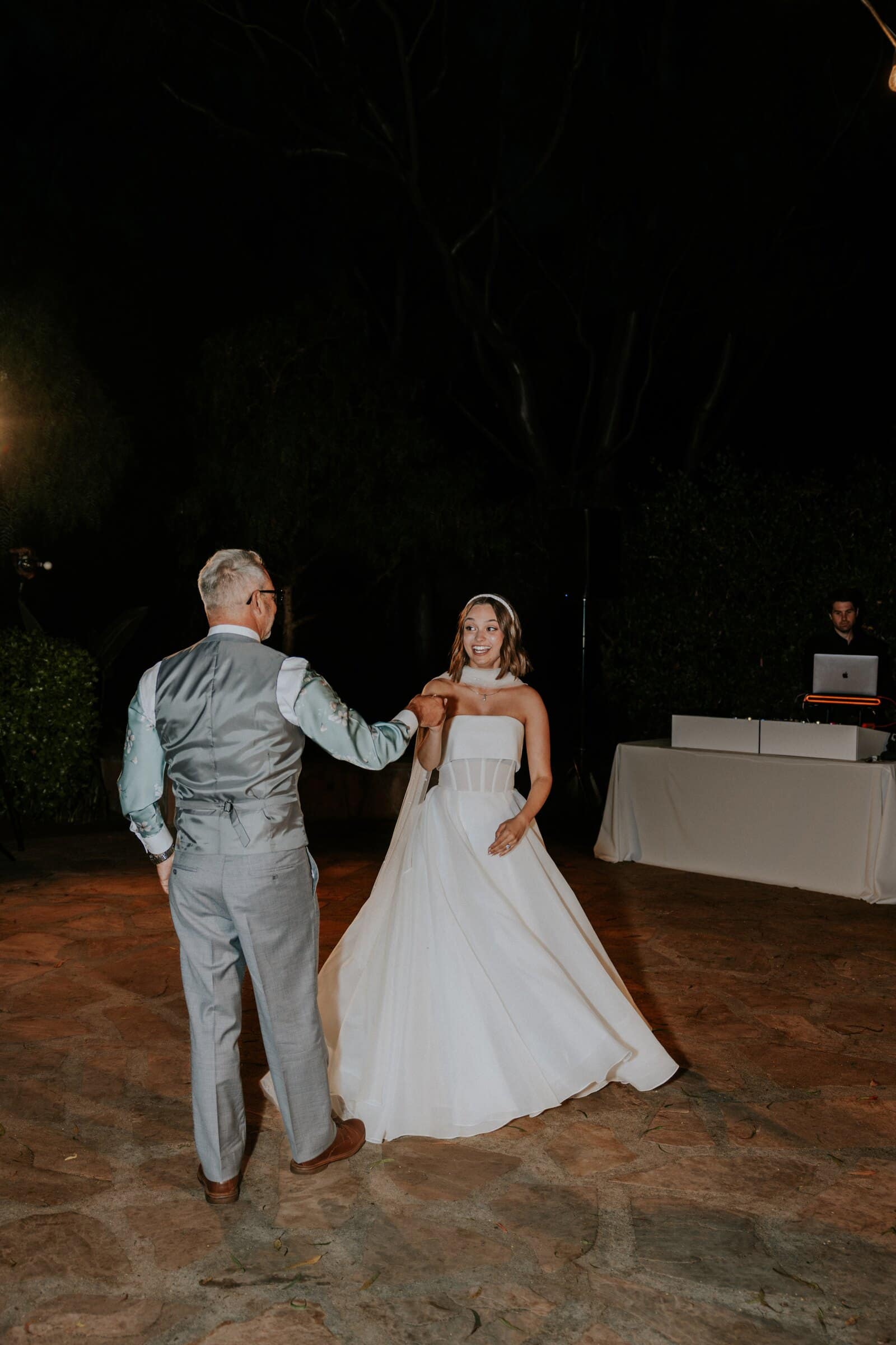 Megan dancing with a man in a grey vest