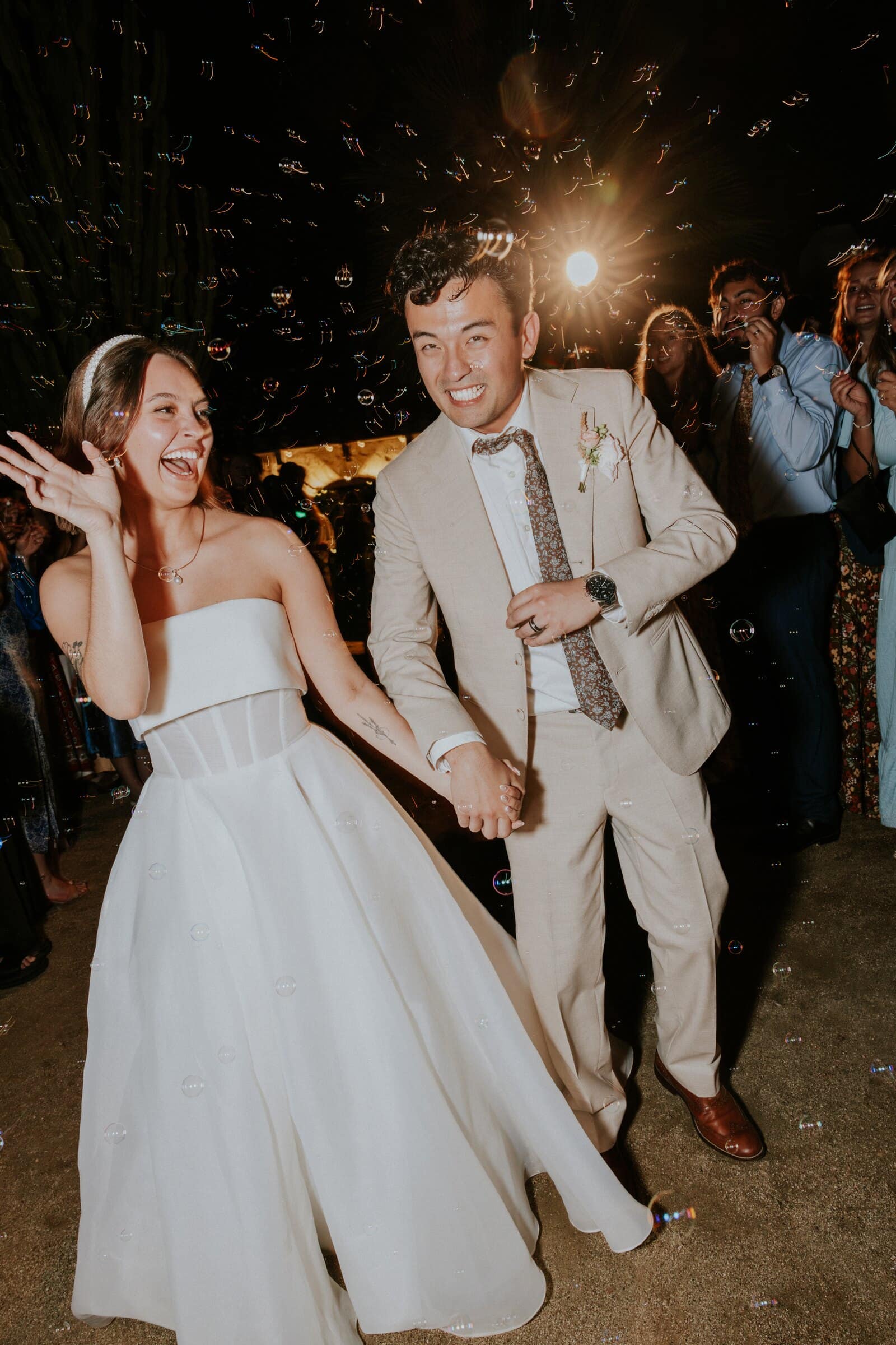 Megan and Caleb dancing as bubbles fall around them