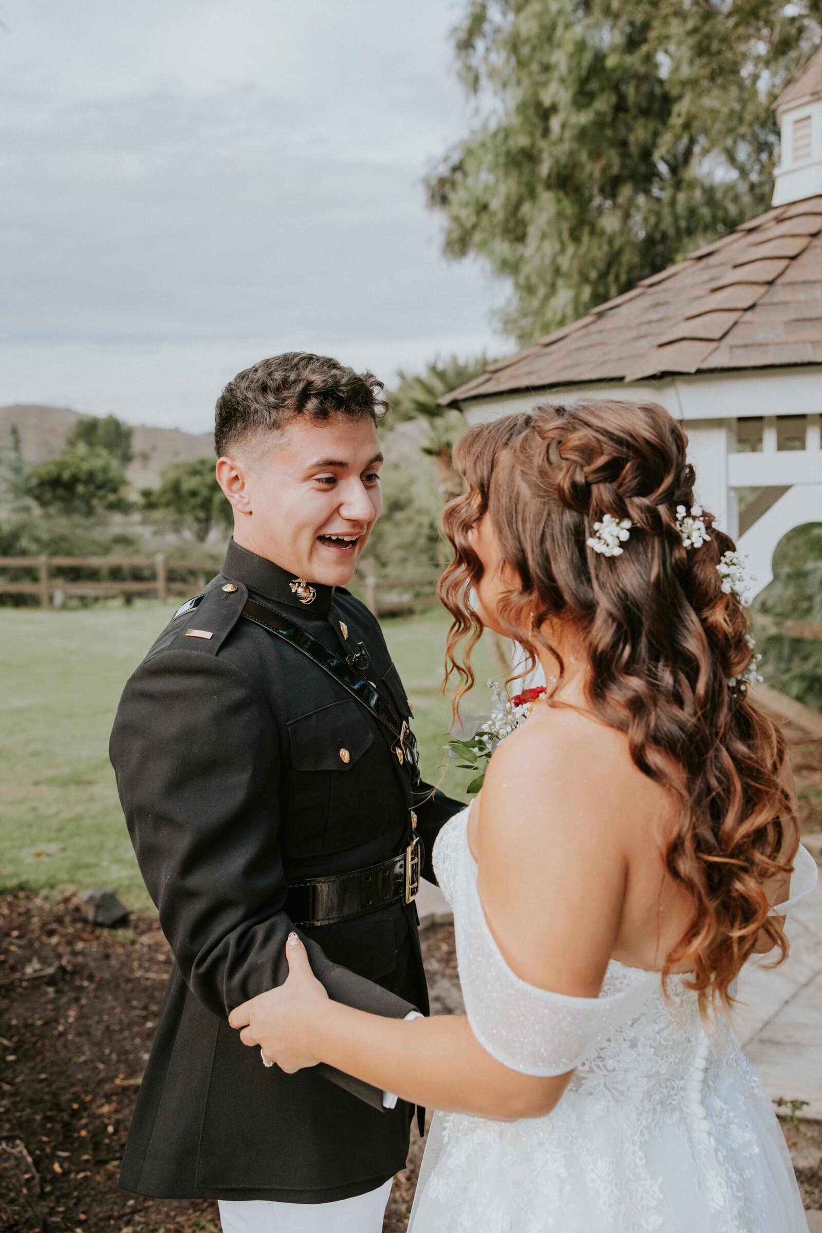 Natalie and David laughing together on the lawn