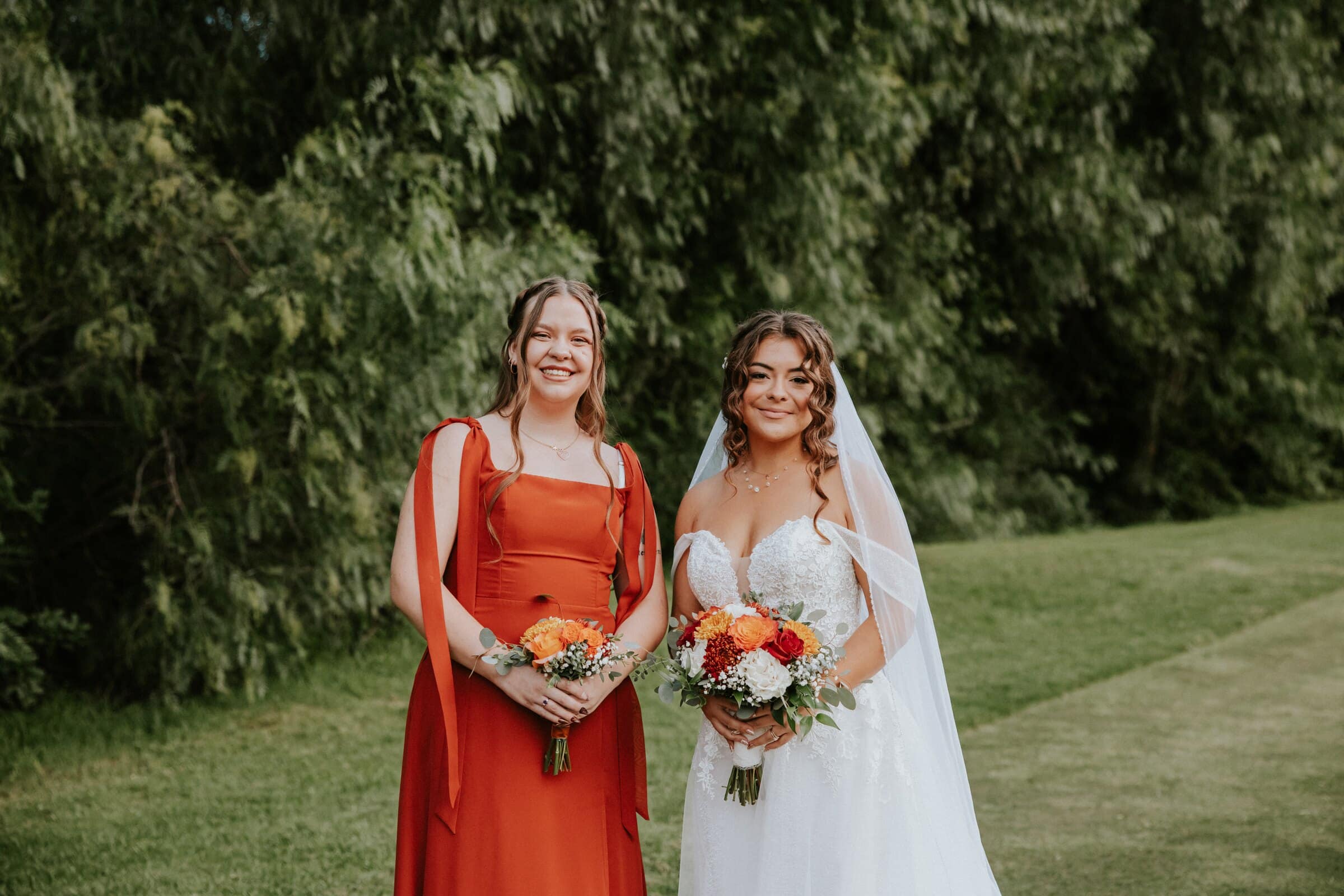 Natalie with a bridesmaid in rust red