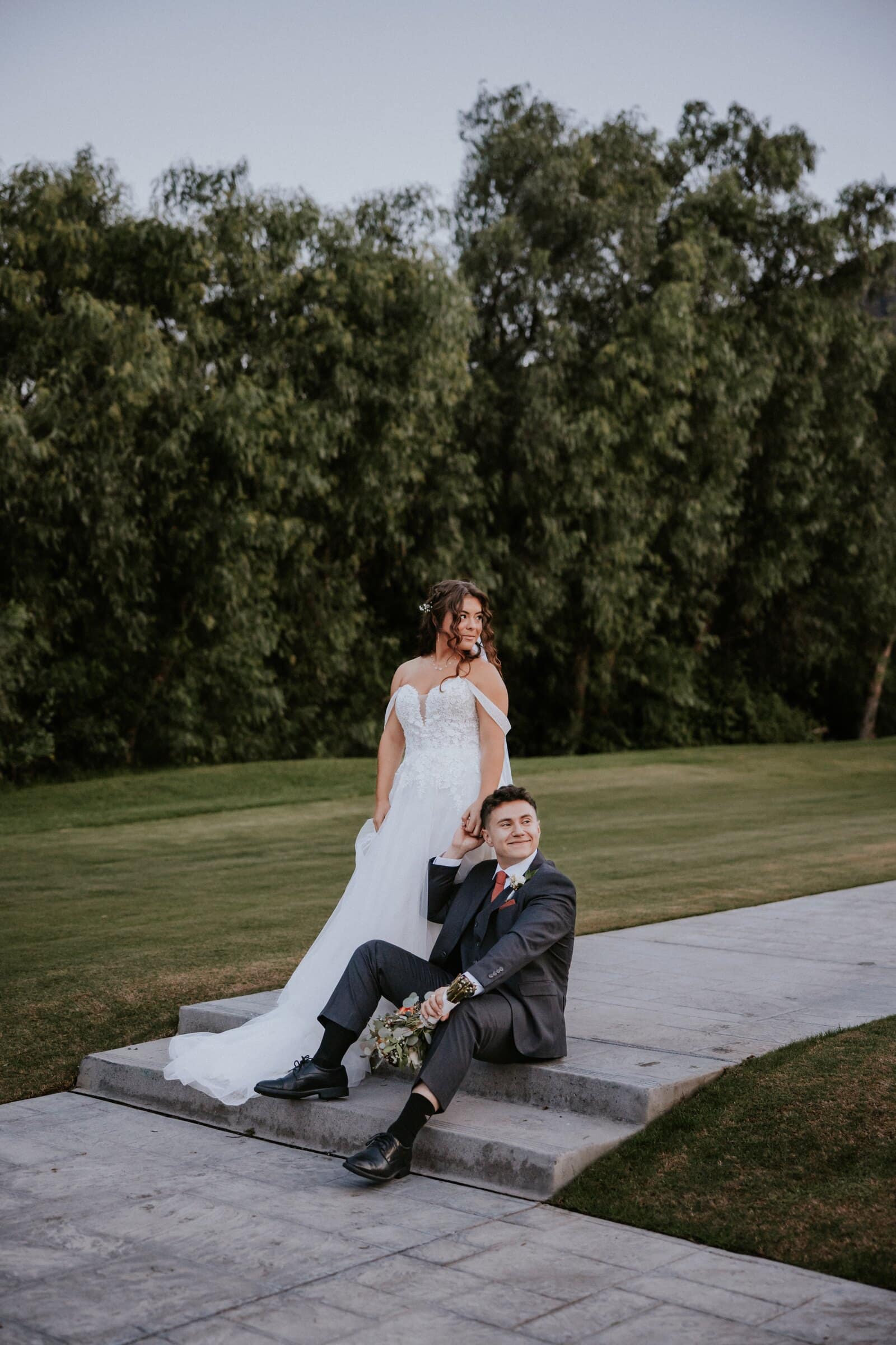 Natalie and David sitting together on garden steps