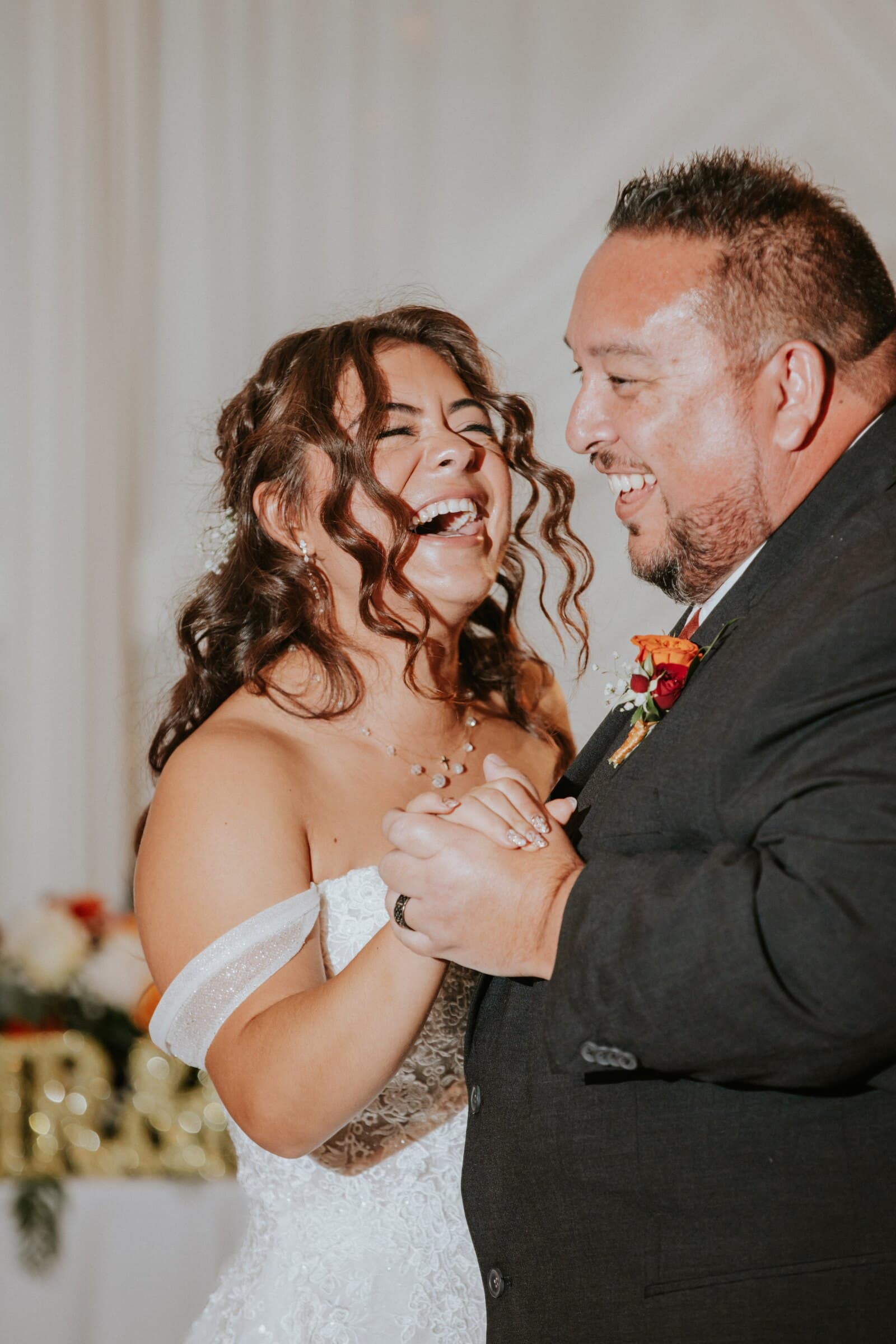Natalie laughing during a dance with family