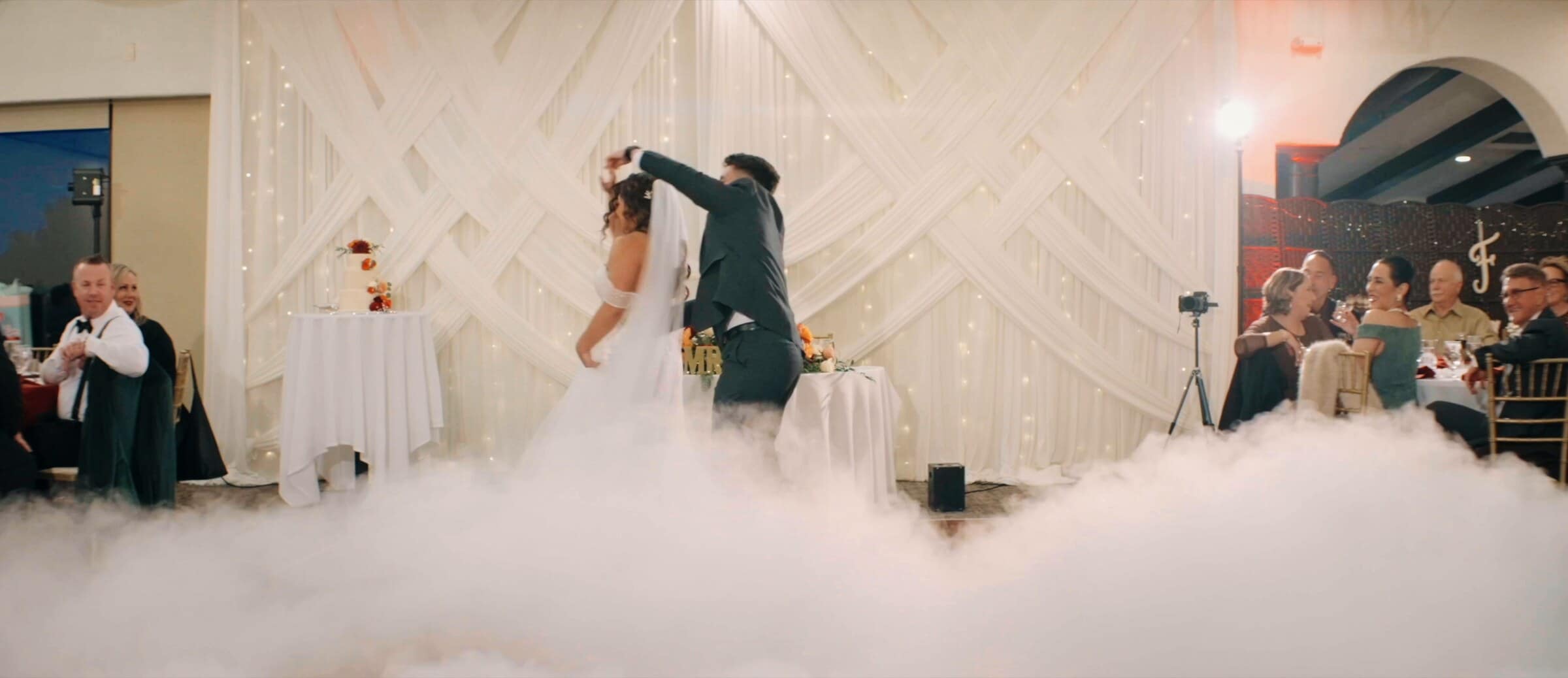 Natalie and David's first dance across a floor covered in low fog