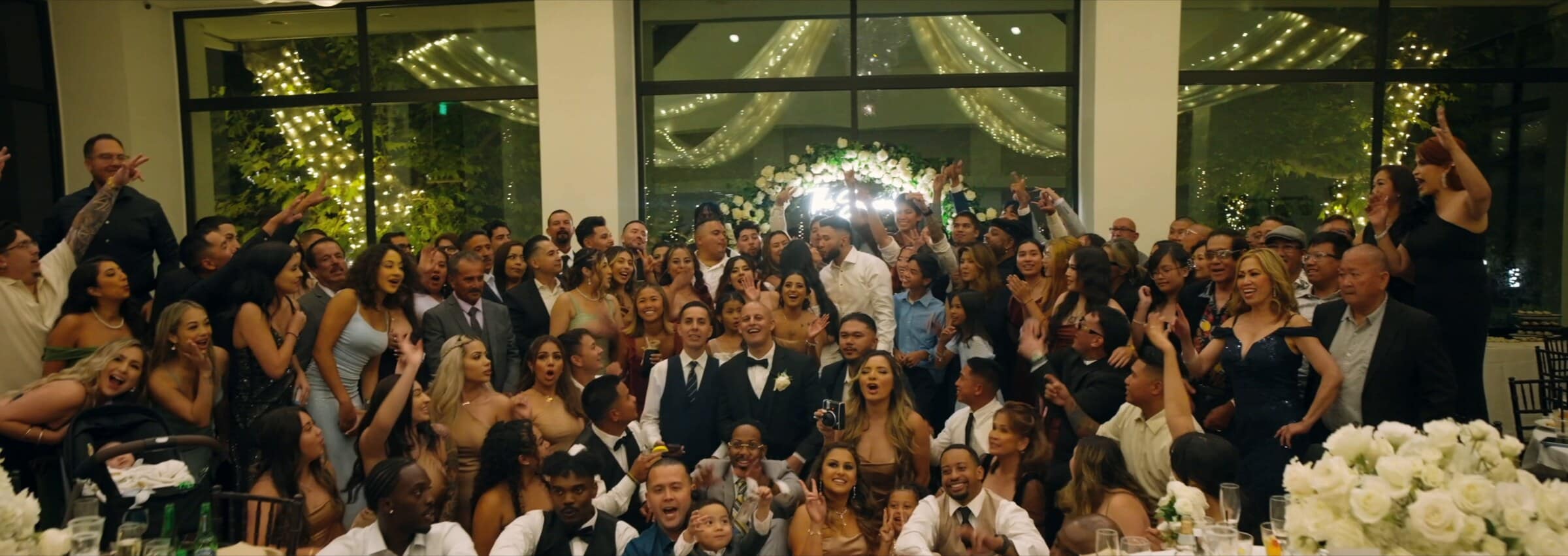 The whole reception cheering for the camera