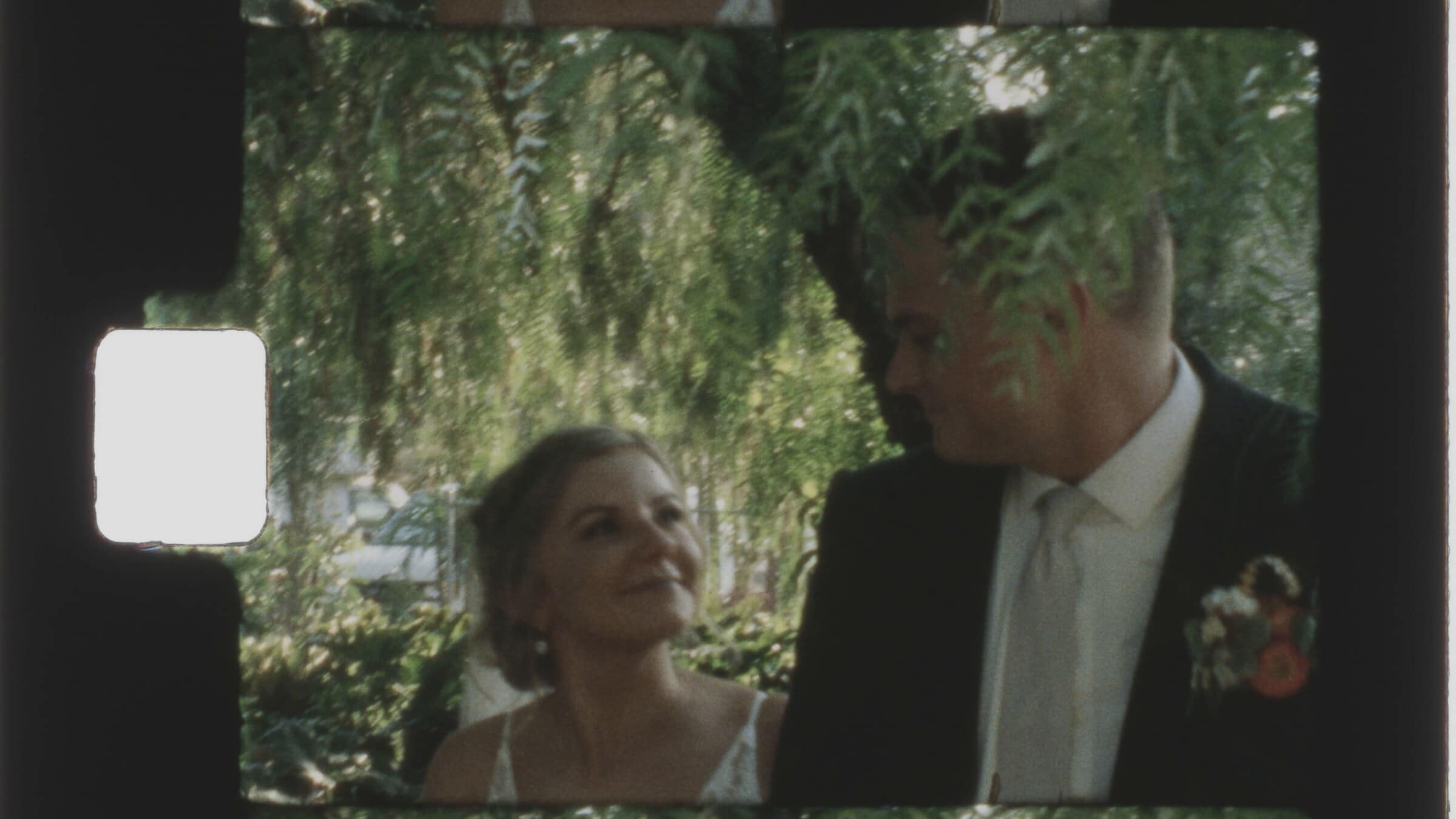 The bride looking up at the groom, on Super 8 film